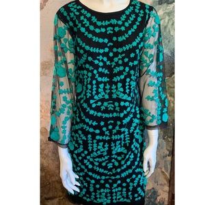 Black and green embroidered Spanish cocktail dress by Almatrichi